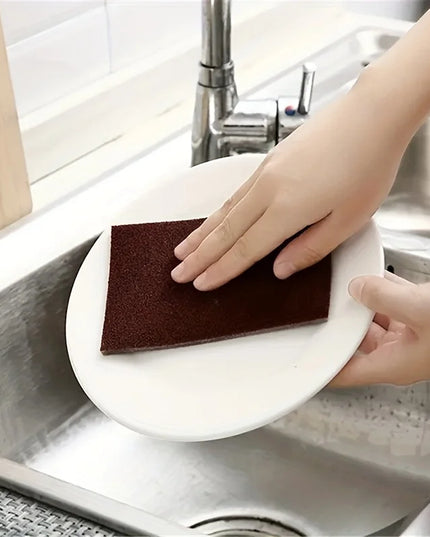Cleaning wipe on plate with sink in background 