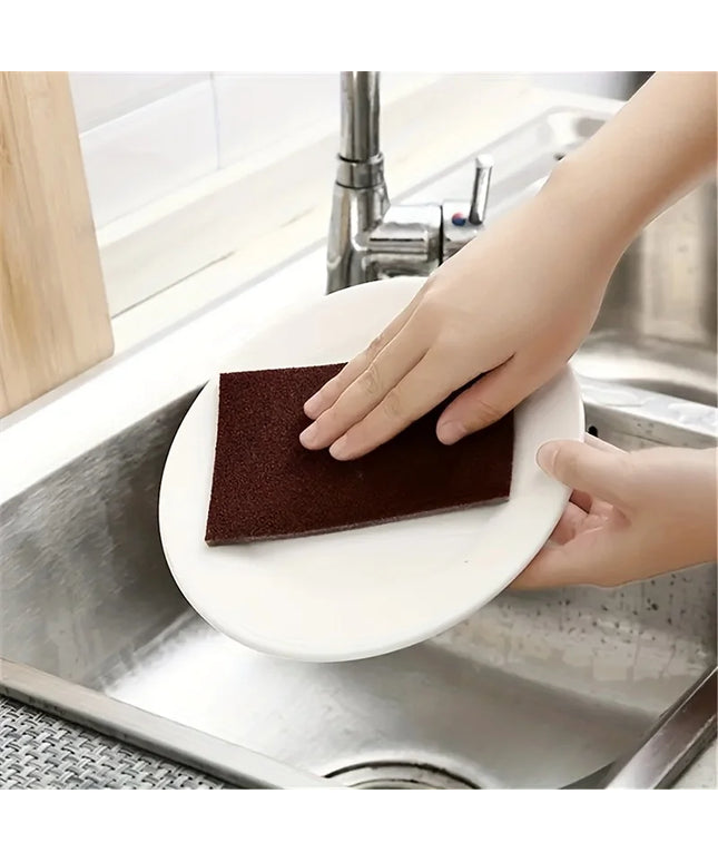Cleaning wipe on plate with sink in background 