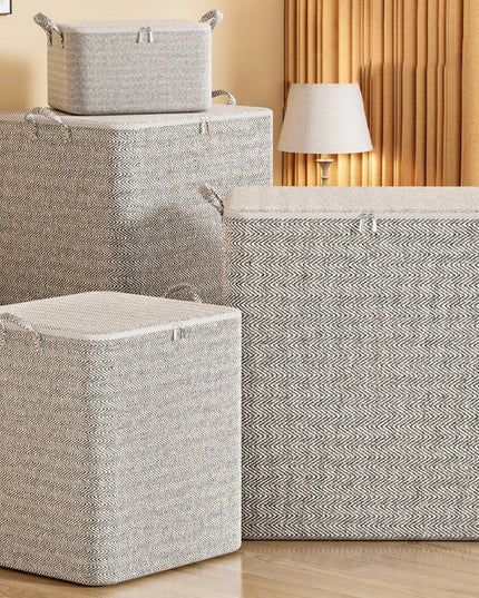 Set of gray storage baskets with lids on a wooden floor.
