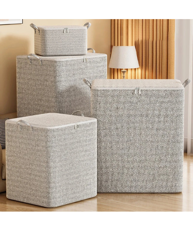Set of gray storage baskets with lids on a wooden floor.