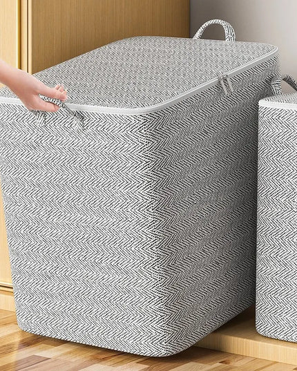 Gray laundry basket with a pattern on a wooden floor