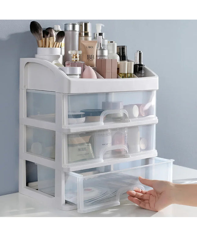 Make up box organiser on a wooden seat with a blue painted wall in background 