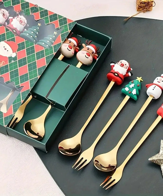 Set of Christmas-themed gold cutlery with decorative handles on a dark surface.