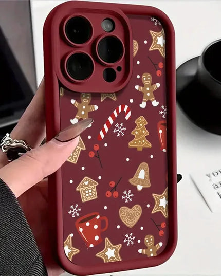 Phone case with Christmas-themed design held by a hand, with a blurred background
