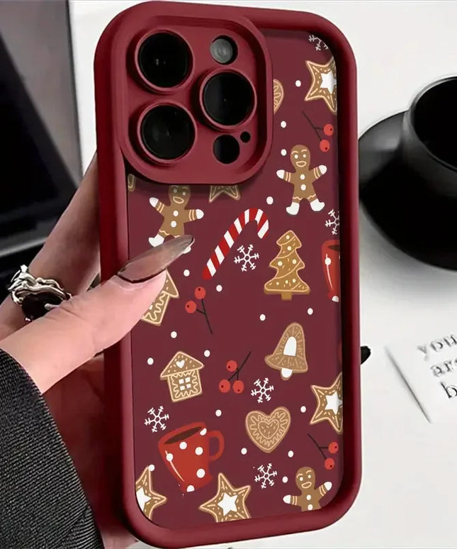 Phone case with Christmas-themed design held by a hand, with a blurred background