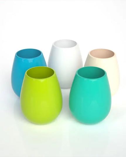 Set of colorful plastic cups on a white background