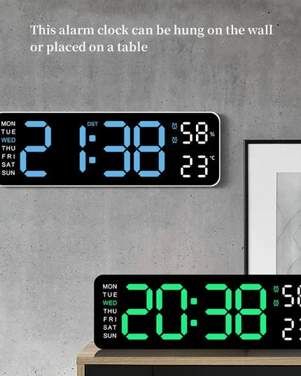 Digital alarm clock with blue and green display on a gray wall.