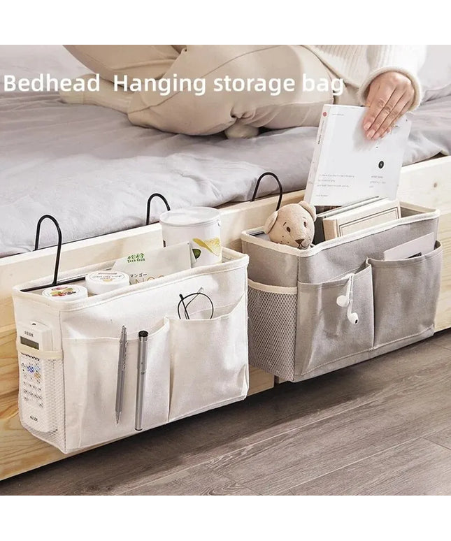 Bedhead hanging storage bag with various items on a bed