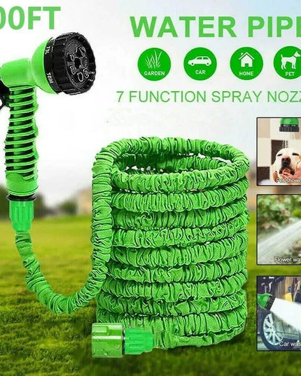 Green water pipe with 7 function spray nozzle on a grassy background